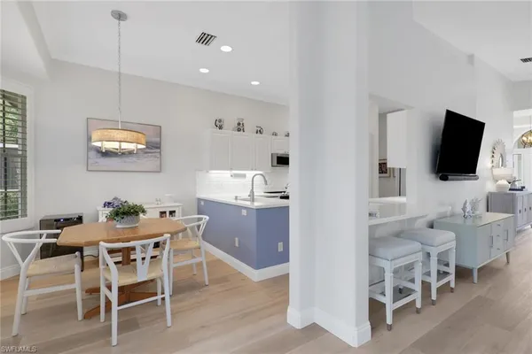 a kitchen with refrigerator cabinets and white appliances