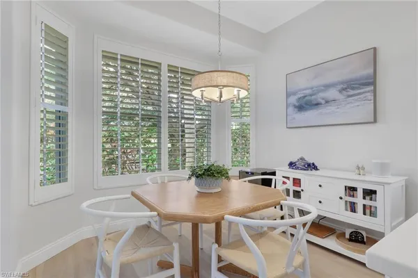 a view of a dining room with furniture window and outside view