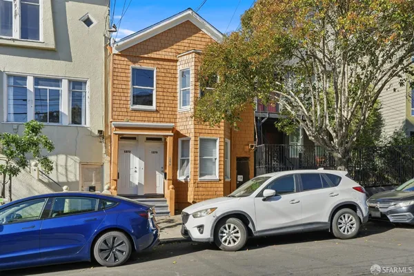 a car parked in front of a house
