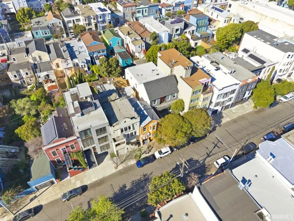 an aerial view of residential house with parking