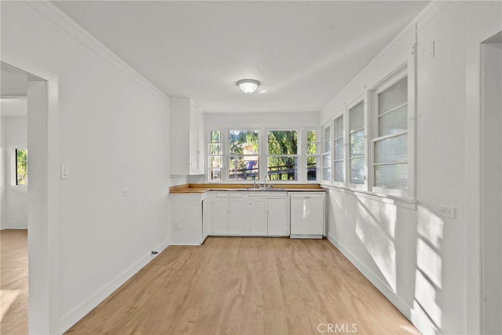 30541 Hasley Canyon Road Castaic, CA 91384 - Photo 11 of 31 a large white kitchen with a sink