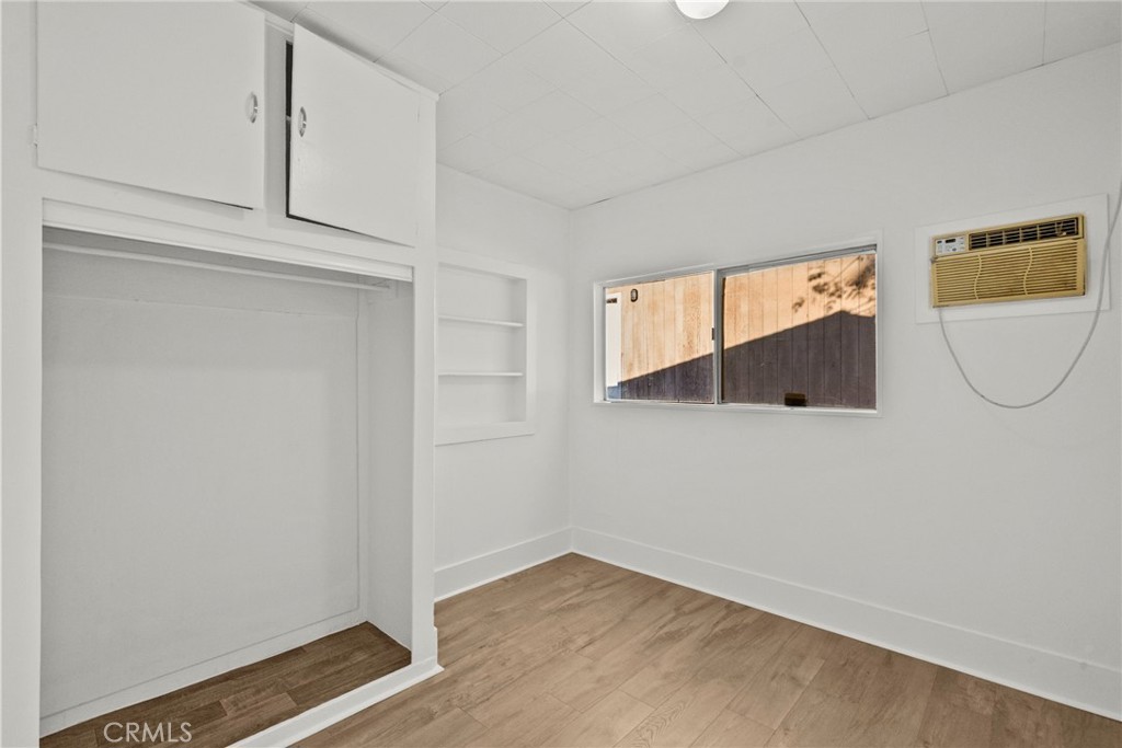 30541 Hasley Canyon Road Castaic, CA 91384 - Photo 14 of 31 a view of a room with wooden floor and cabinets