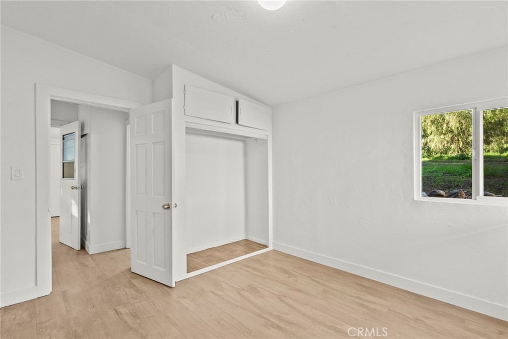 30541 Hasley Canyon Road Castaic, CA 91384 - Photo 21 of 31 an empty room with windows and closet