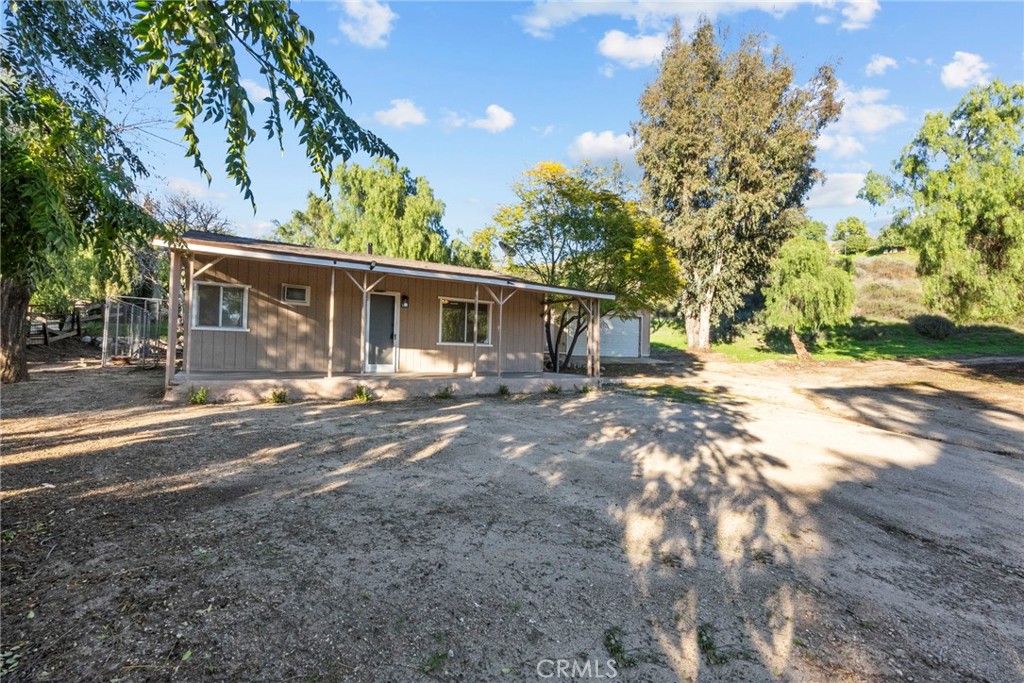 30541 Hasley Canyon Road Castaic, CA 91384 - Photo 22 of 31 a view of a yard with a tree