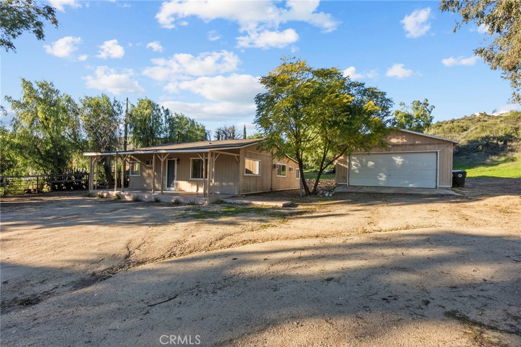 30541 Hasley Canyon Road Castaic, CA 91384 - Photo 23 of 31 a view of house with outdoor space and parking