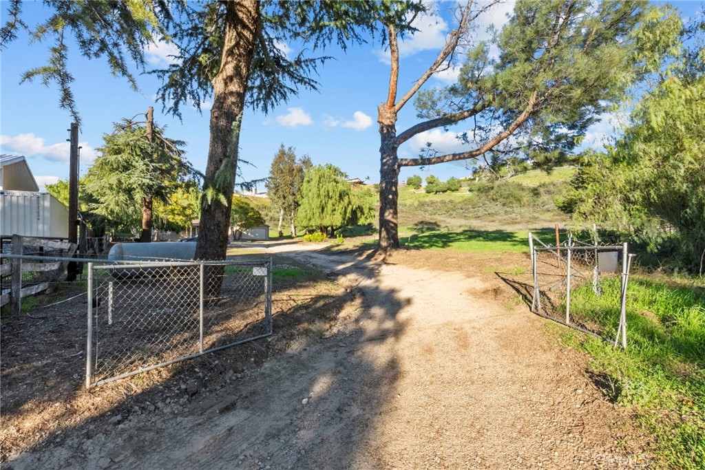 30541 Hasley Canyon Road Castaic, CA 91384 - Photo 28 of 31 a view of a yard with wooden fence