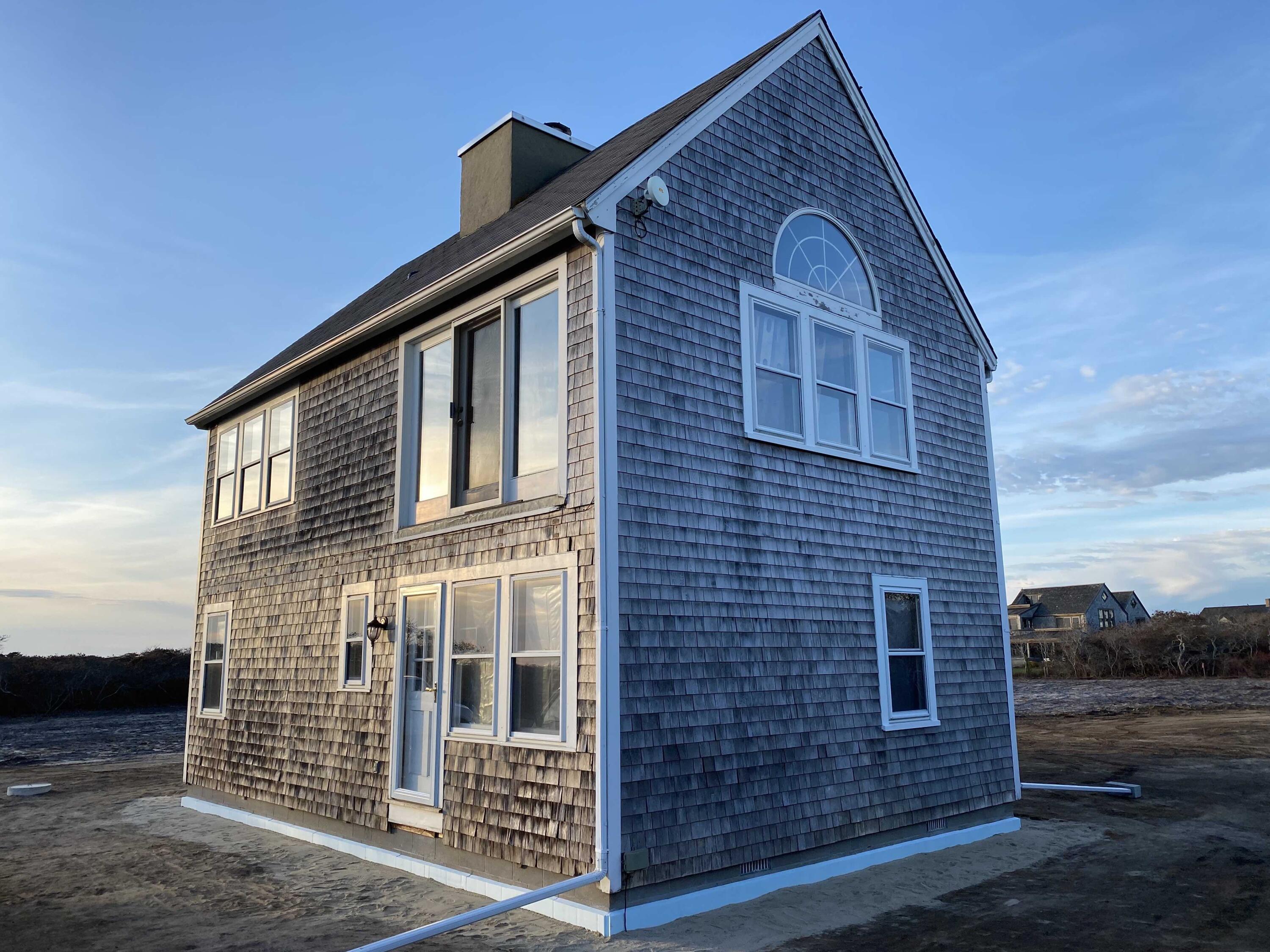 41 Wigwam Road Nantucket, MA 02554 - Photo 4 of 10 a front view of a house with a yard