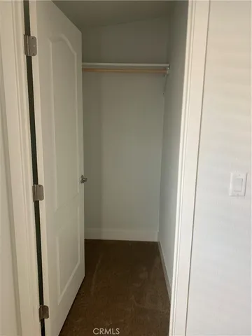 a bathroom with a granite countertop toilet sink and shower