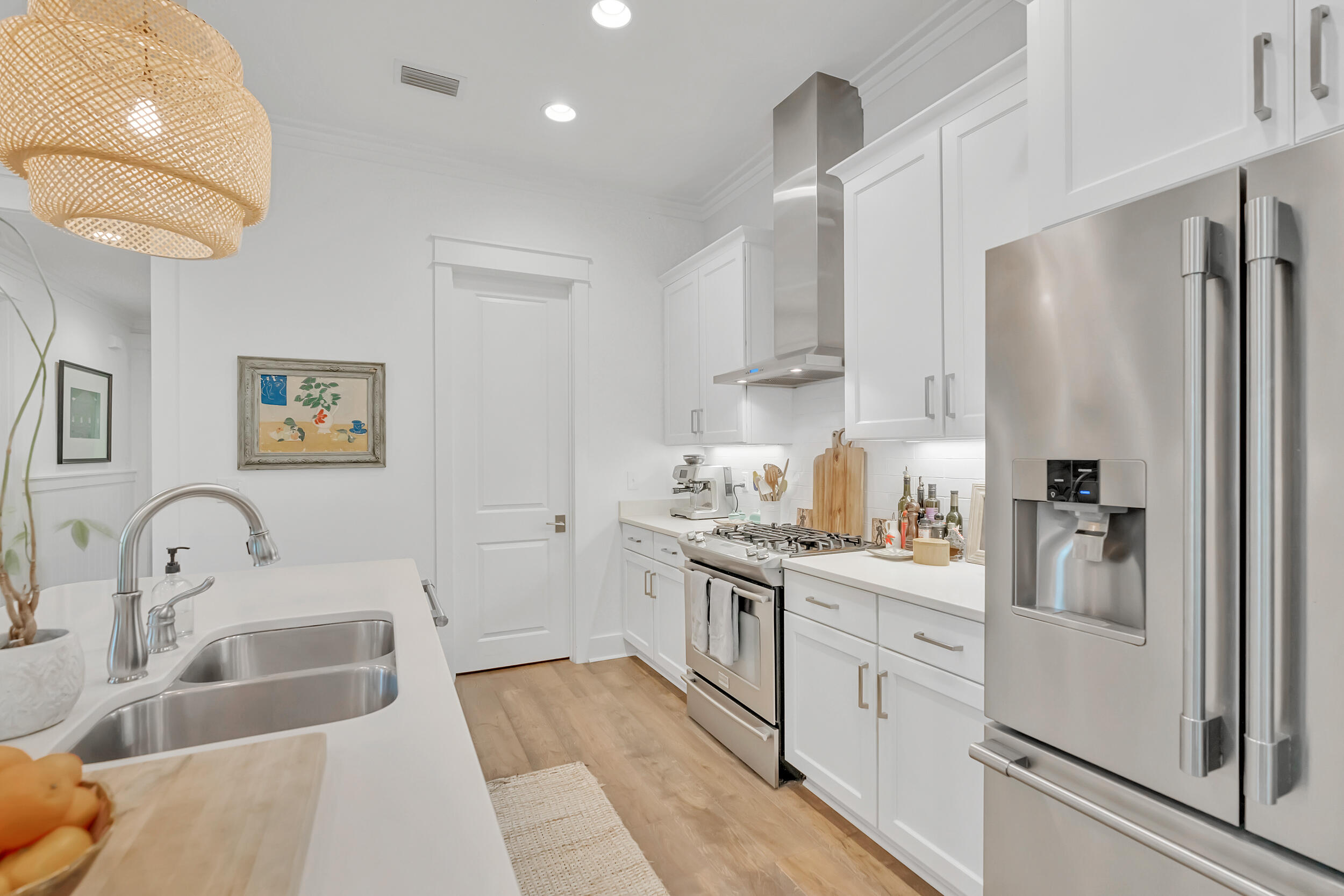 76 Jack Knife Drive Inlet Beach, FL 32461 - Photo 11 of 43 a kitchen with white cabinets and stainless steel appliances