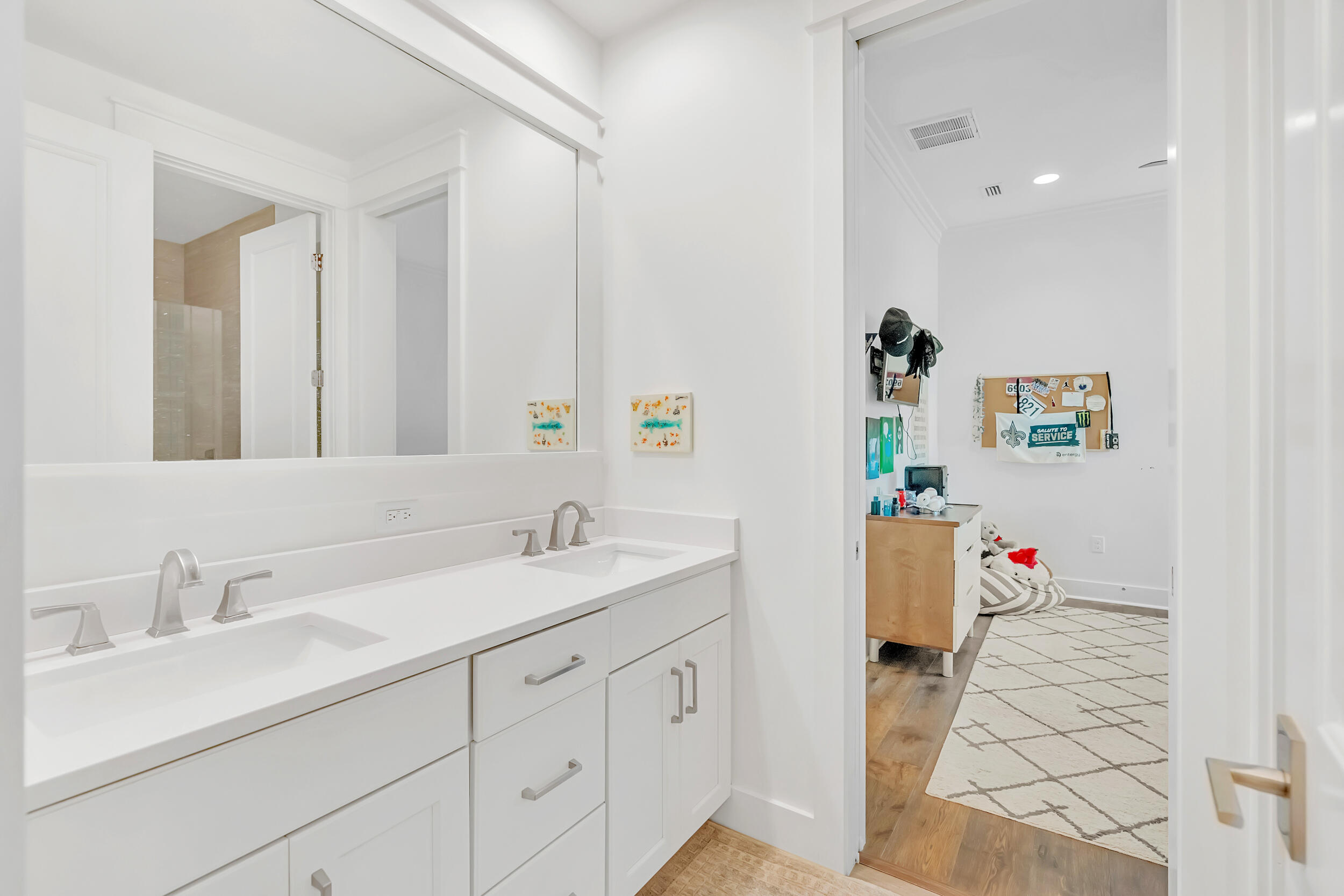 76 Jack Knife Drive Inlet Beach, FL 32461 - Photo 25 of 43 a spacious bathroom with a sink double vanity and mirror