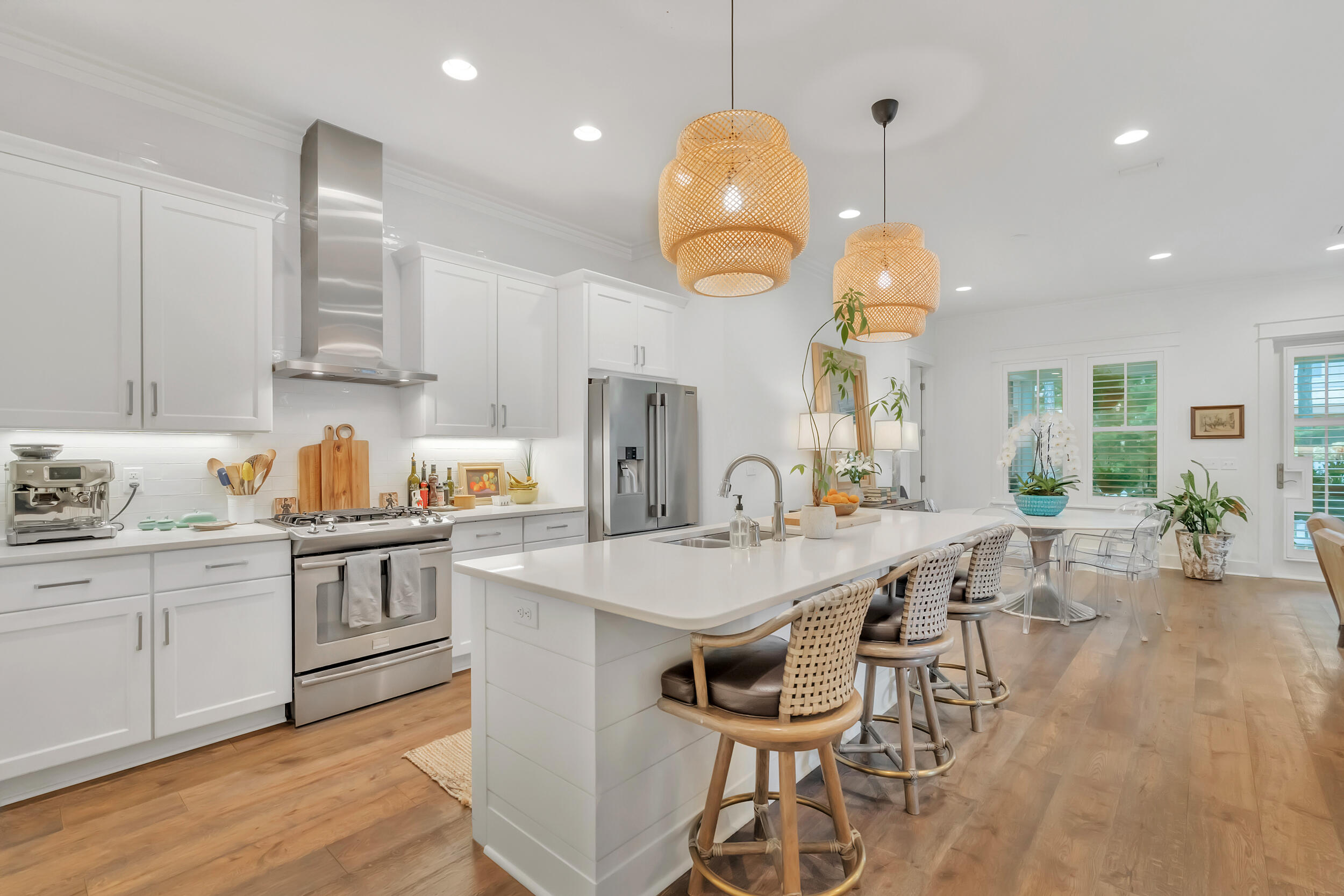 76 Jack Knife Drive Inlet Beach, FL 32461 - Photo 8 of 43 a kitchen with stainless steel appliances a table chairs sink and stove