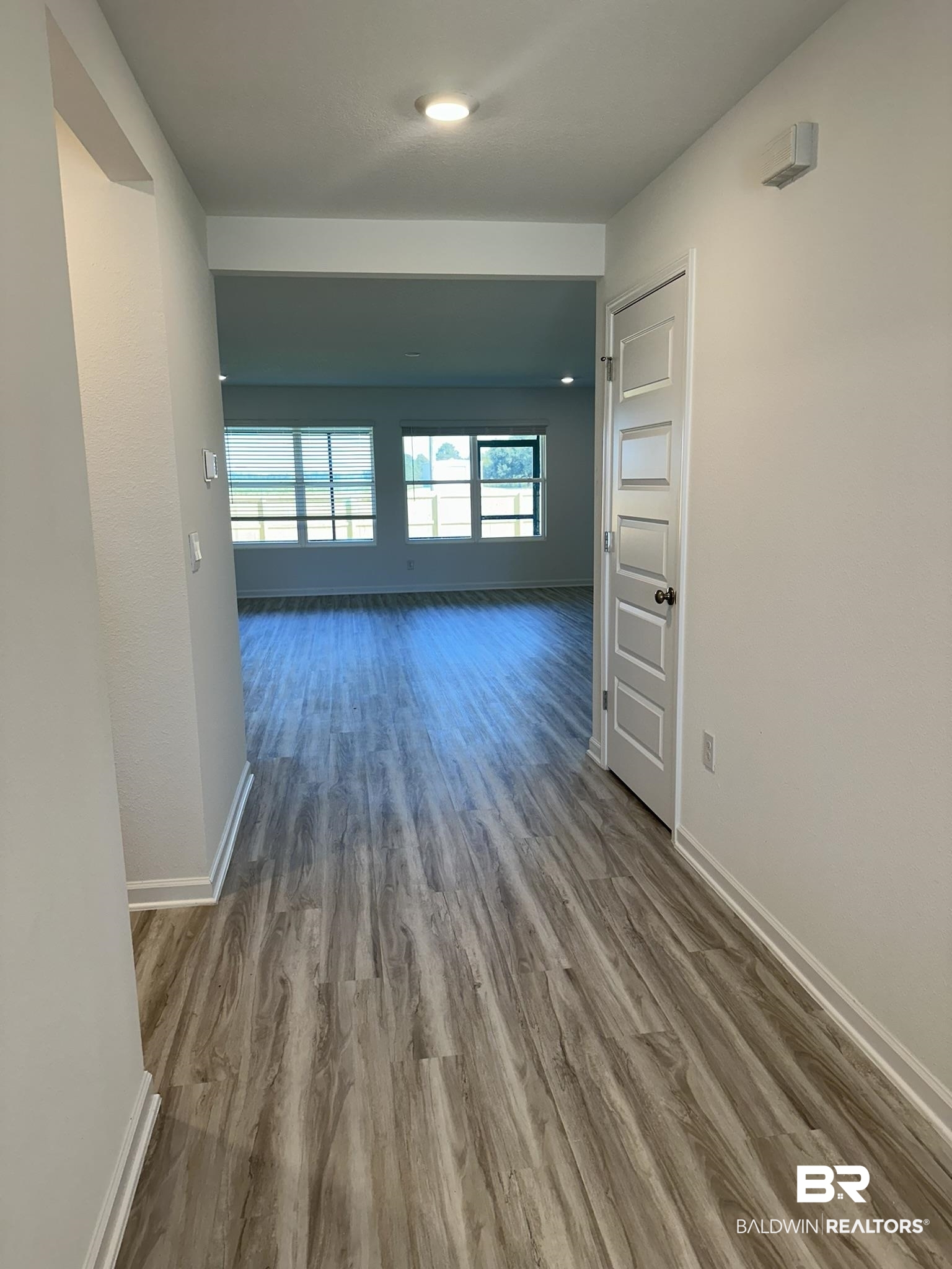 22227 Aleutian Avenue Foley, AL 36535 - Photo 5 of 64 Corridor with hardwood / wood-style floors