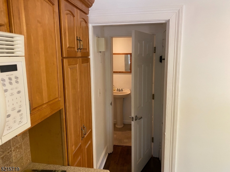 36 Elm Road Caldwell, NJ 07006 - Photo 11 of 28 a view of a bathroom with a glass door