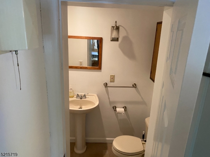 36 Elm Road Caldwell, NJ 07006 - Photo 12 of 28 a white toilet sitting next to a bathroom sink