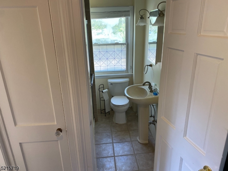 36 Elm Road Caldwell, NJ 07006 - Photo 19 of 28 a bathroom with a toilet and a sink