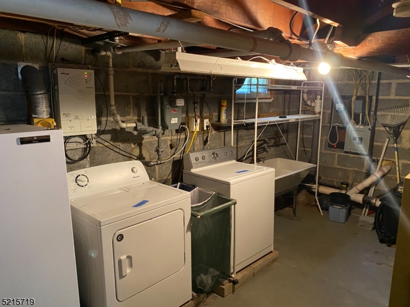 36 Elm Road Caldwell, NJ 07006 - Photo 26 of 28 a utility room with dryer and washer