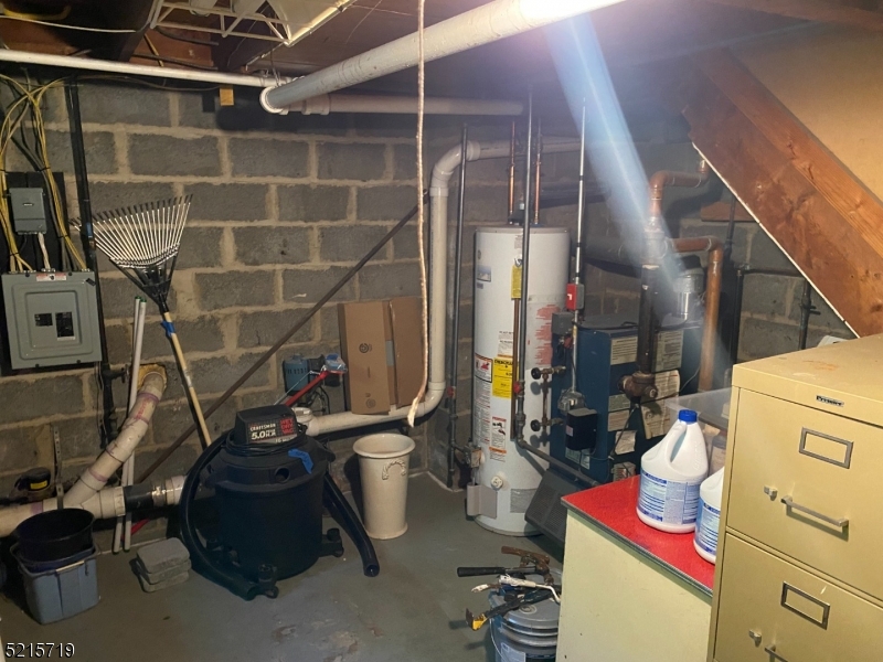 36 Elm Road Caldwell, NJ 07006 - Photo 28 of 28 a storage room with washer and dryer