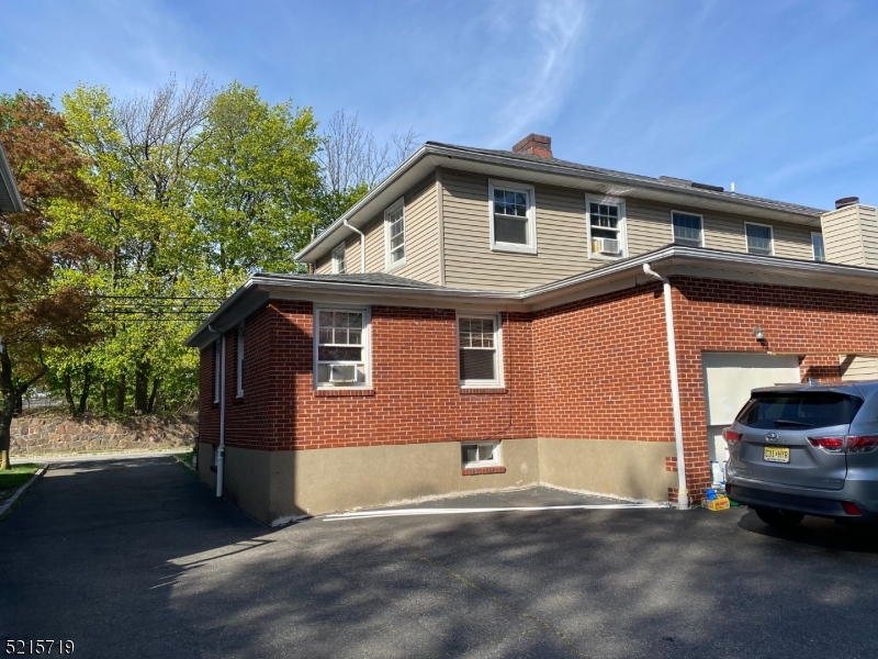 36 Elm Road Caldwell, NJ 07006 - Photo 3 of 28 a view of a house with a yard and garage