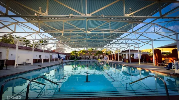 a view of a swimming pool with a patio