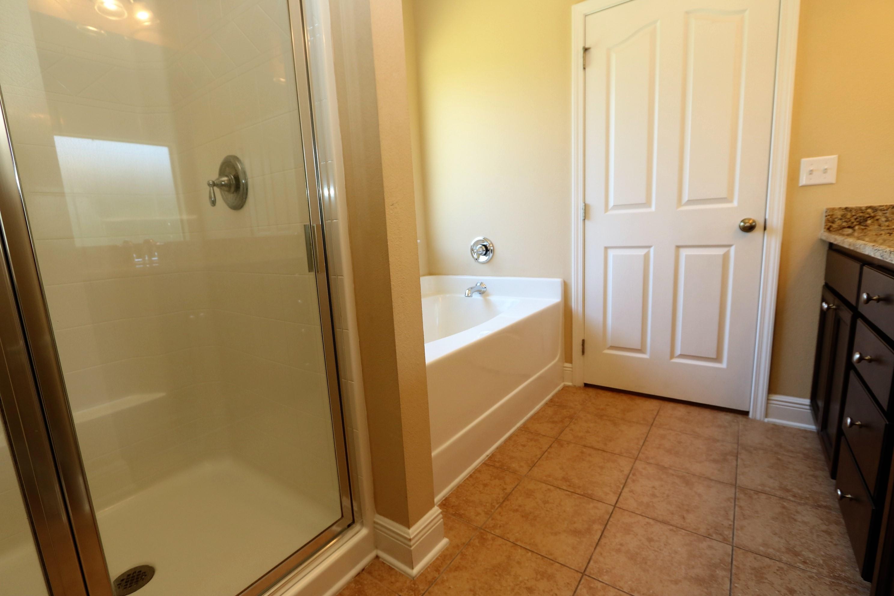 679 Red Fern Road Crestview, FL 32536 - Photo 14 of 22 a bathroom with a tub and shower