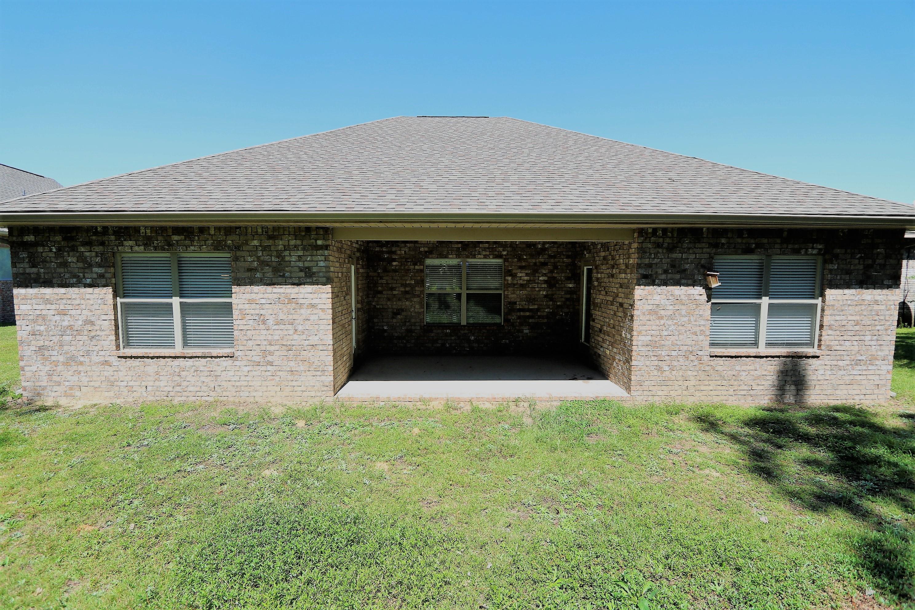 679 Red Fern Road Crestview, FL 32536 - Photo 22 of 22 a front view of a house with a yard