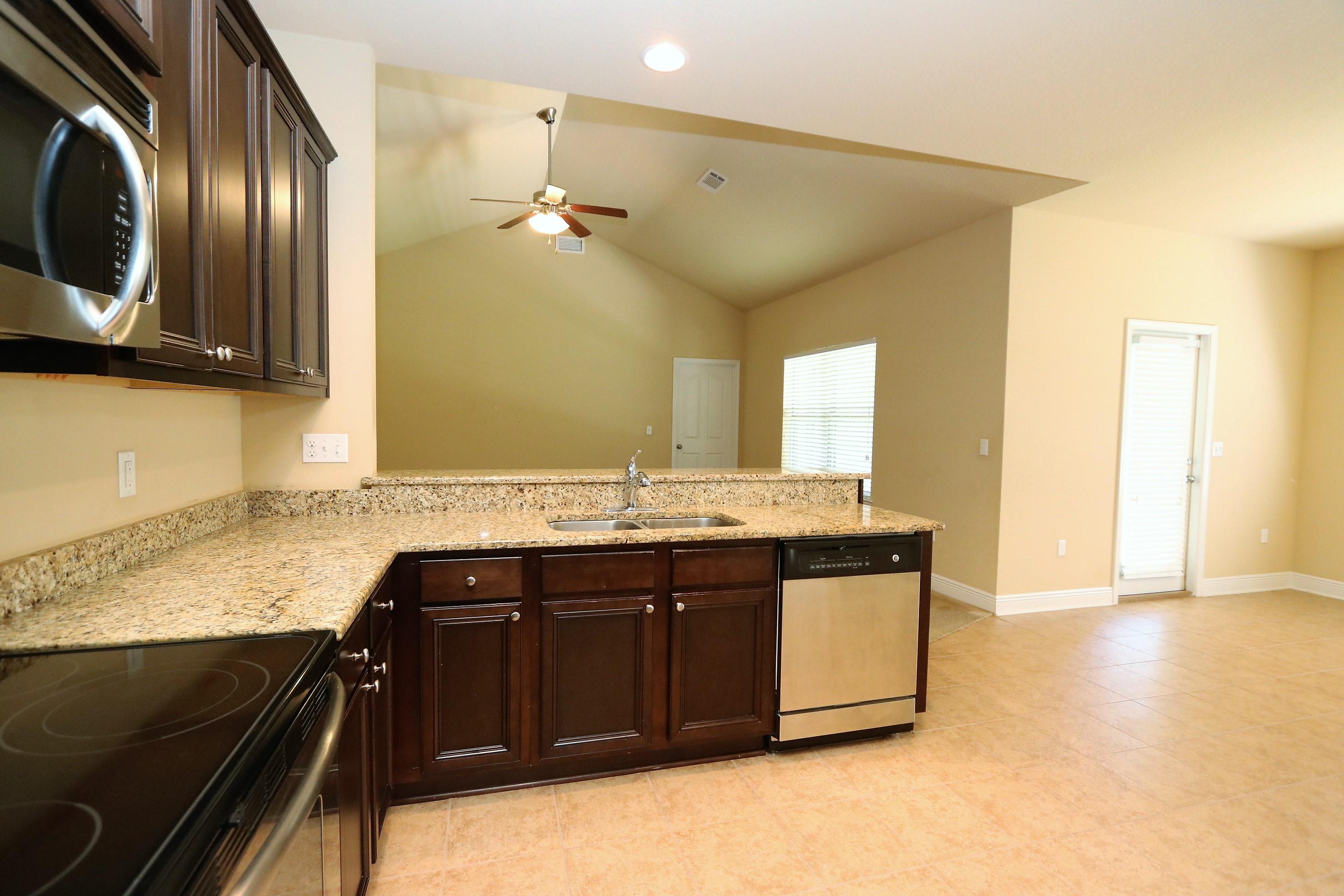 679 Red Fern Road Crestview, FL 32536 - Photo 8 of 22 a bathroom with a granite countertop sink and a mirror