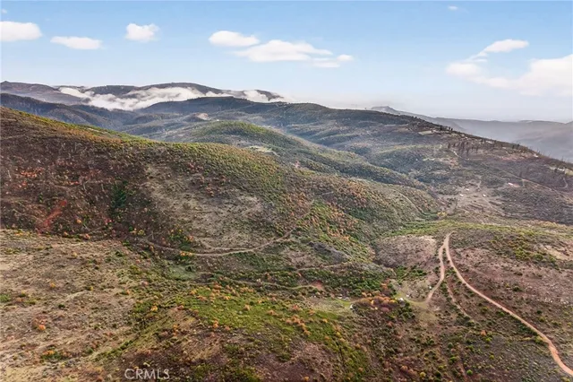 a view of mountains and valleys