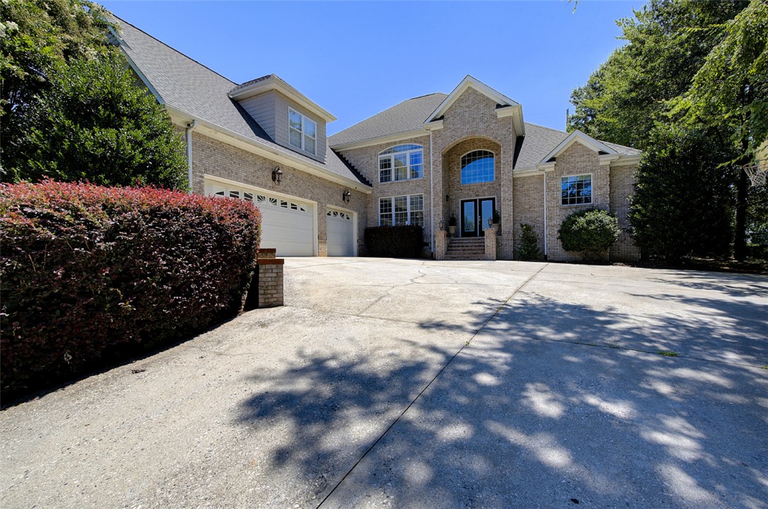 100 Turnberry Road Anderson, SC 29621 - Photo 1 of 41 A grand, traditional residence featuring a spacious driveway and attached two-car garage.