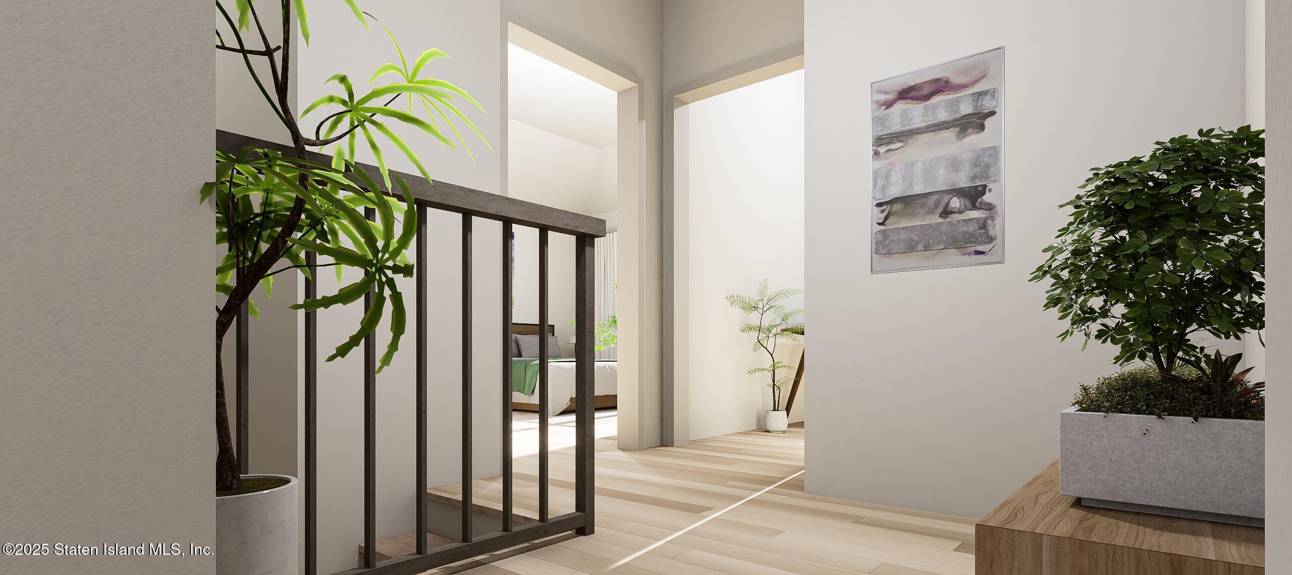 1239 Forest Hill Road, Unit 8 Staten Island, NY 10314 - Photo 15 of 15 a view of a hallway with wooden floor and a potted plant