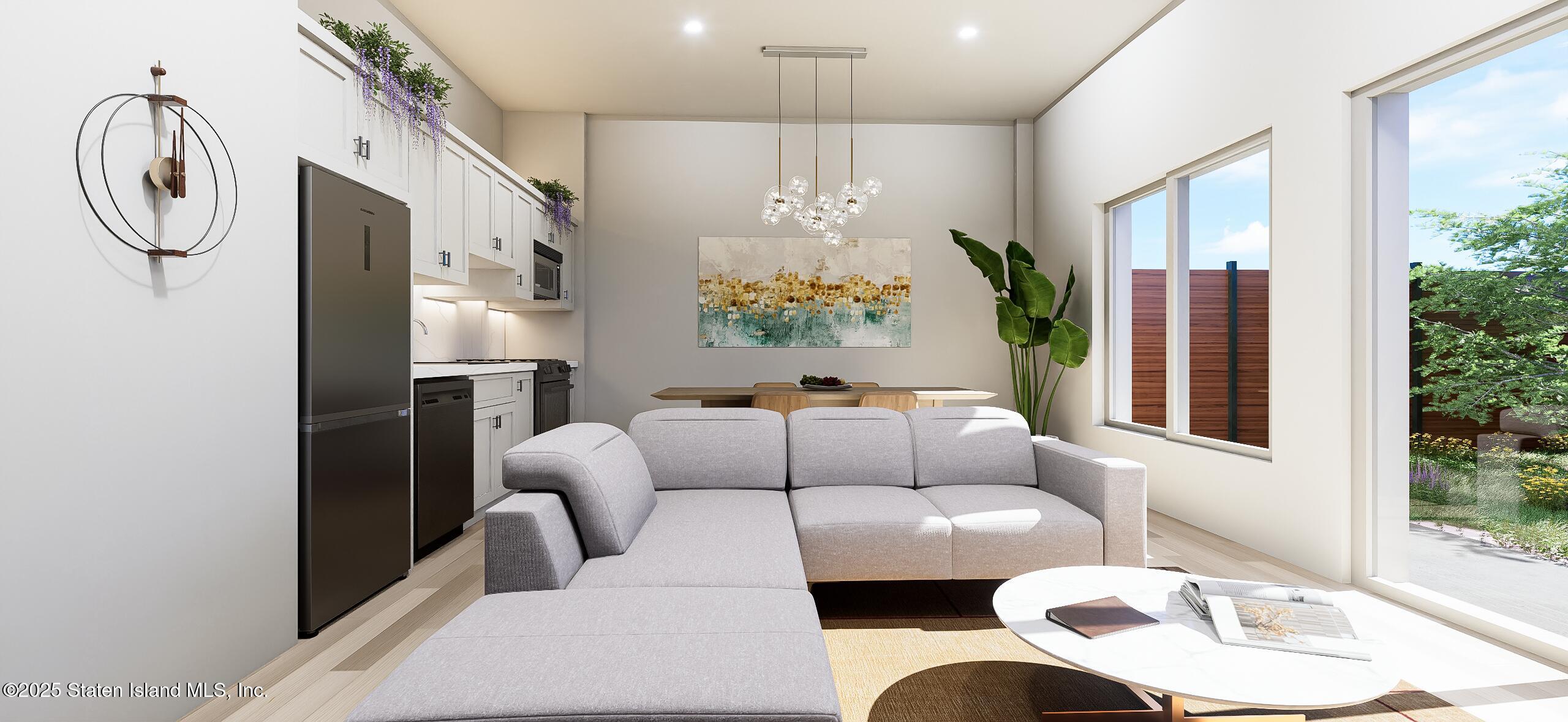 1239 Forest Hill Road, Unit 8 Staten Island, NY 10314 - Photo 3 of 15 a living room with furniture and a large window