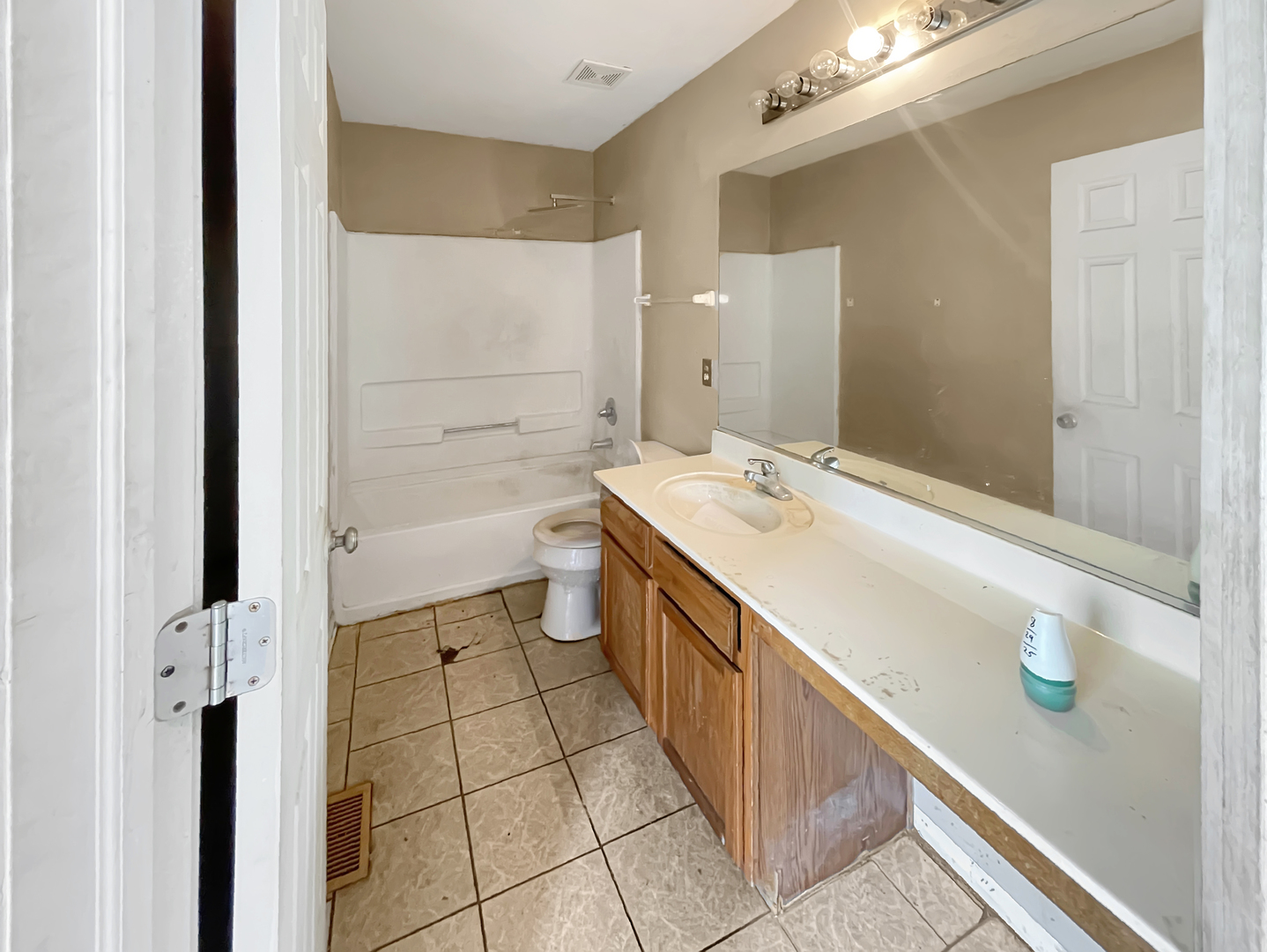 625 Edward Drive Romeoville, IL 60446 - Photo 10 of 15 a bathroom with a double vanity sink a mirror and a bathtub
