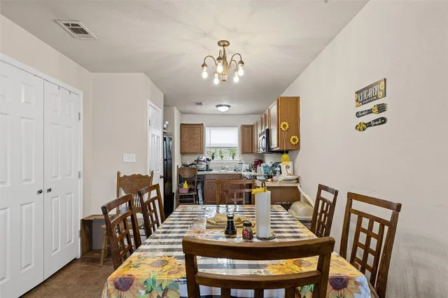 a view of a dining room with furniture