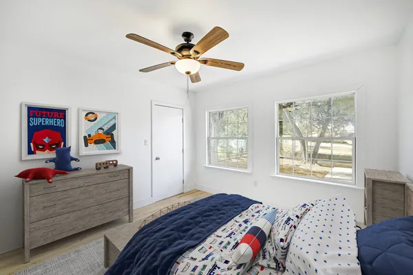 a bedroom with a bed and cabinets