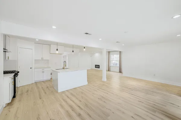 a view of kitchen with wooden floor