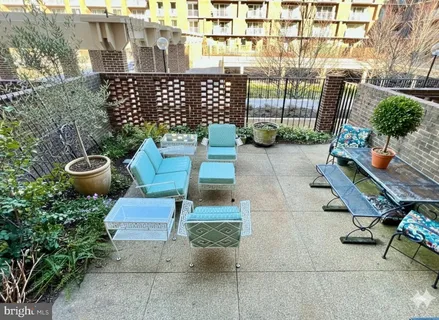 a chairs and bench in front of a building