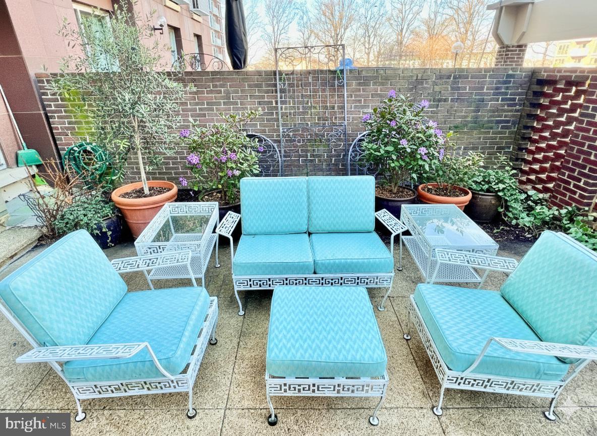 520 N Street Southwest, Unit S112 Washington, DC 20024 - Photo 21 of 46 a backyard of a house with outdoor seating