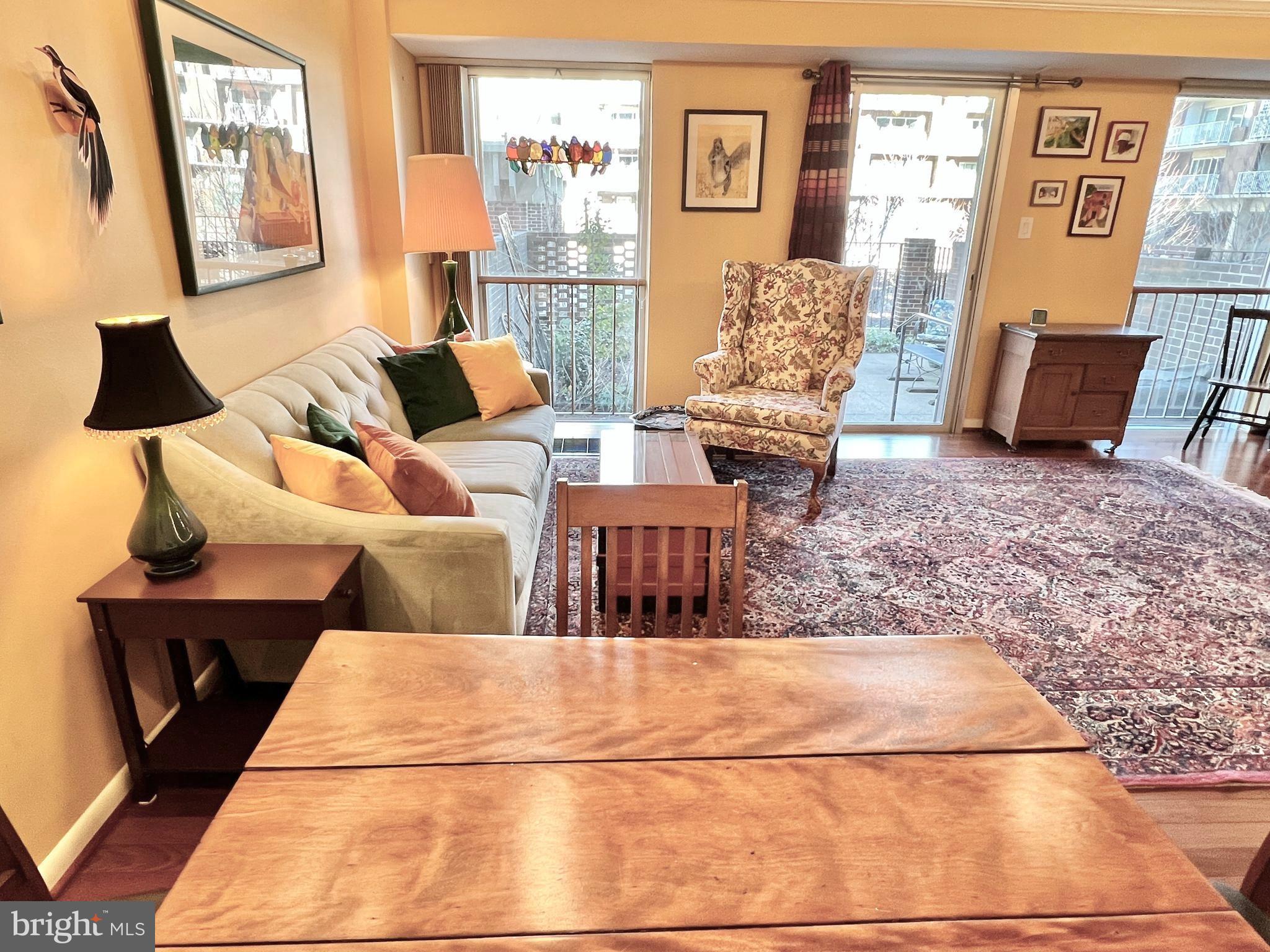 520 N Street Southwest, Unit S112 Washington, DC 20024 - Photo 4 of 46 a living room with furniture and wooden floor