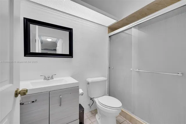 a bedroom with a bed and a desk