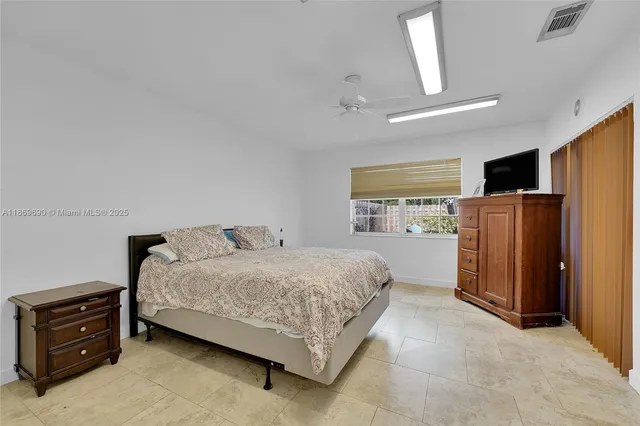 a view of a bathroom with a sink and a mirror