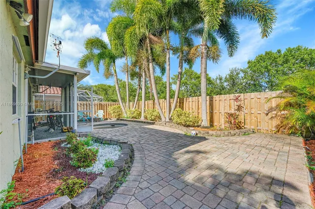 a view of a house with a sink and yard