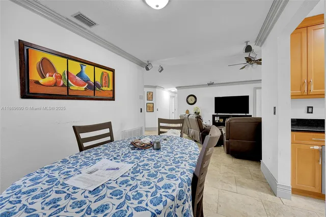 a kitchen with stainless steel appliances granite countertop a refrigerator a stove and a sink