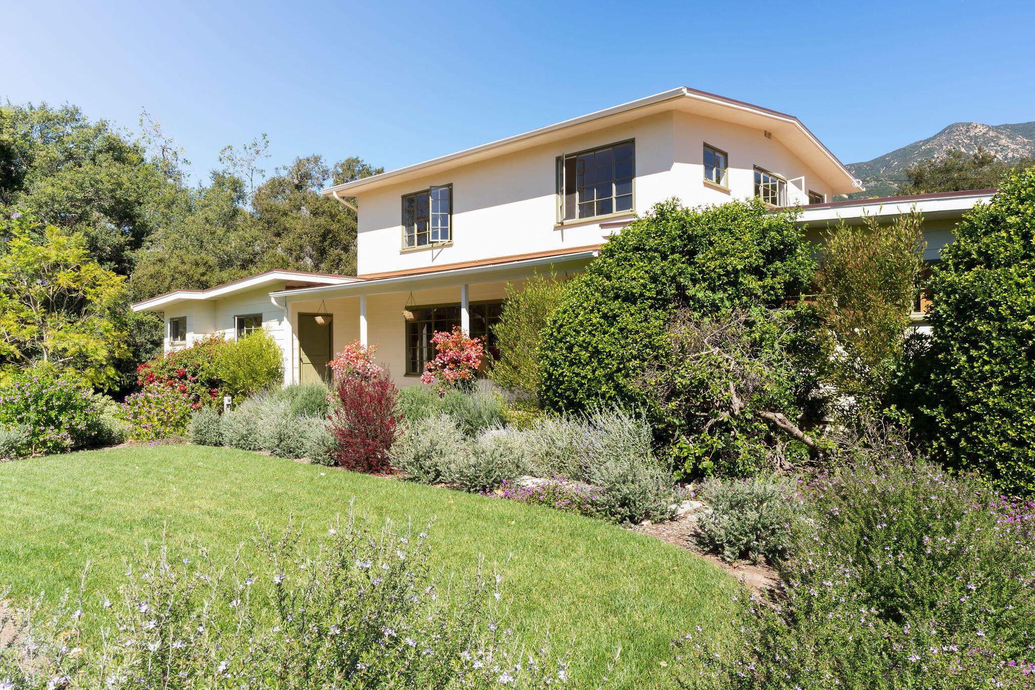 633 Tabor Lane Montecito, CA 93108 - Photo 1 of 30 a front view of a house with a yard and trees