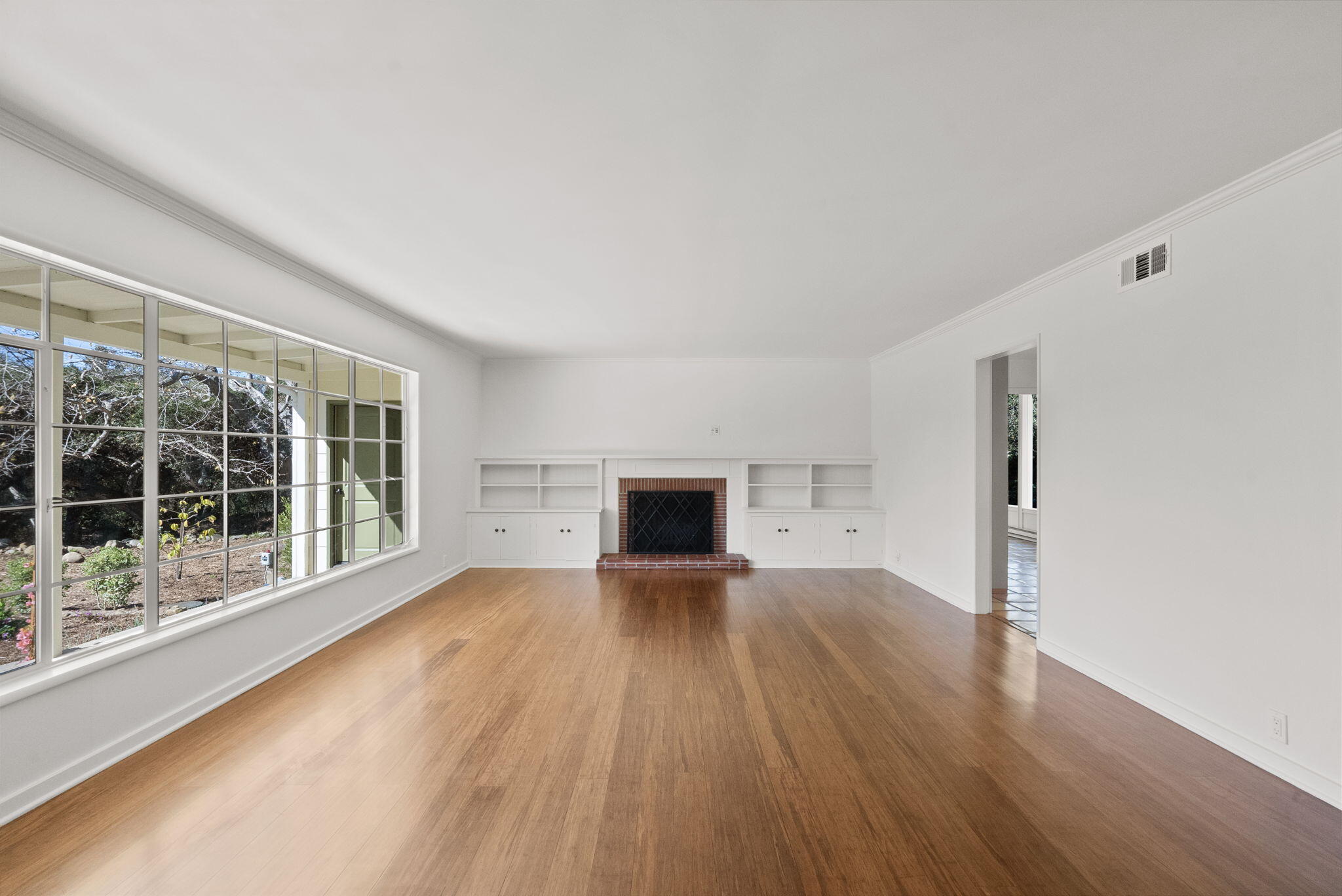 633 Tabor Lane Montecito, CA 93108 - Photo 12 of 30 a view of a big room with wooden floor and a window