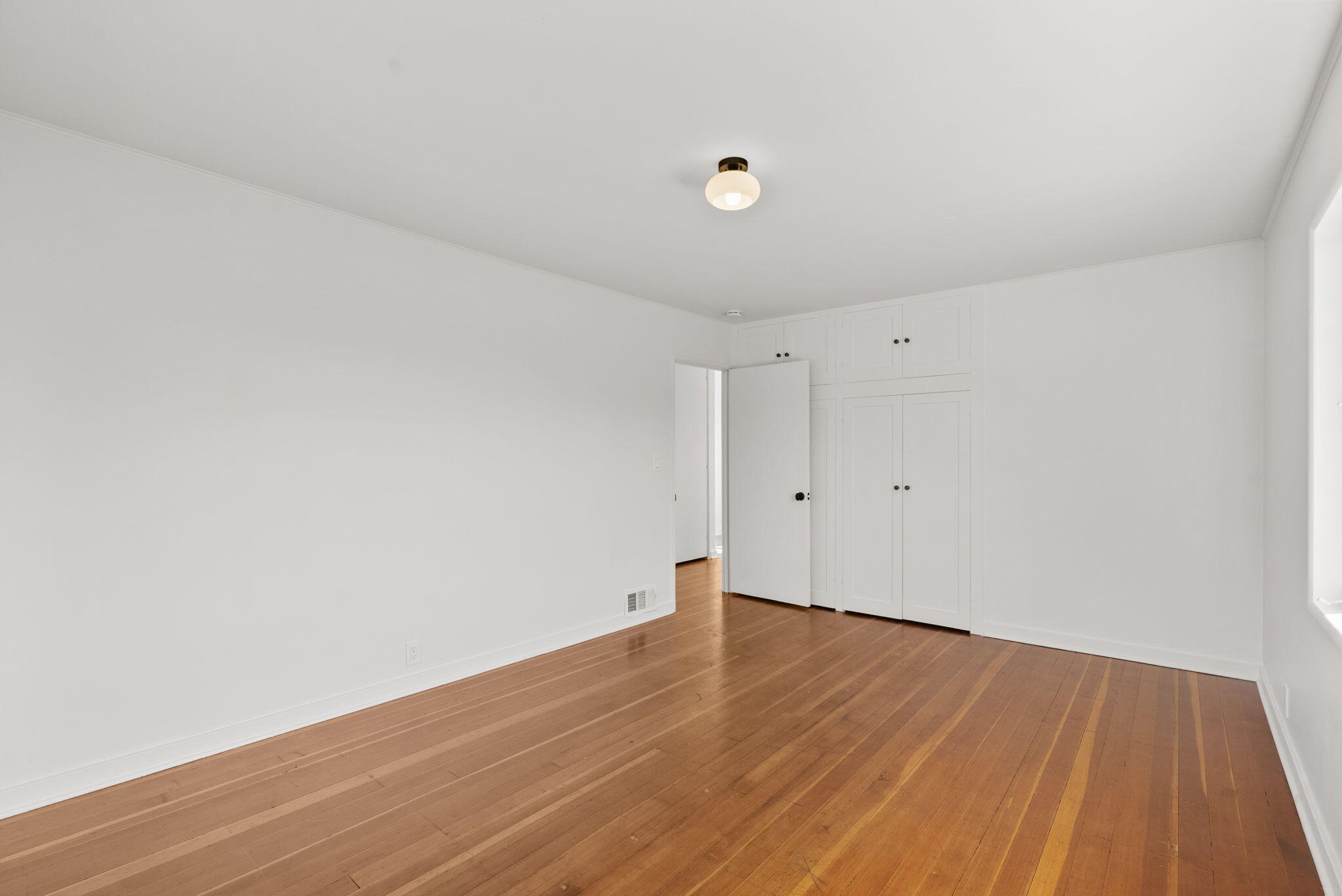 633 Tabor Lane Montecito, CA 93108 - Photo 19 of 30 a view of an empty room with wooden floor