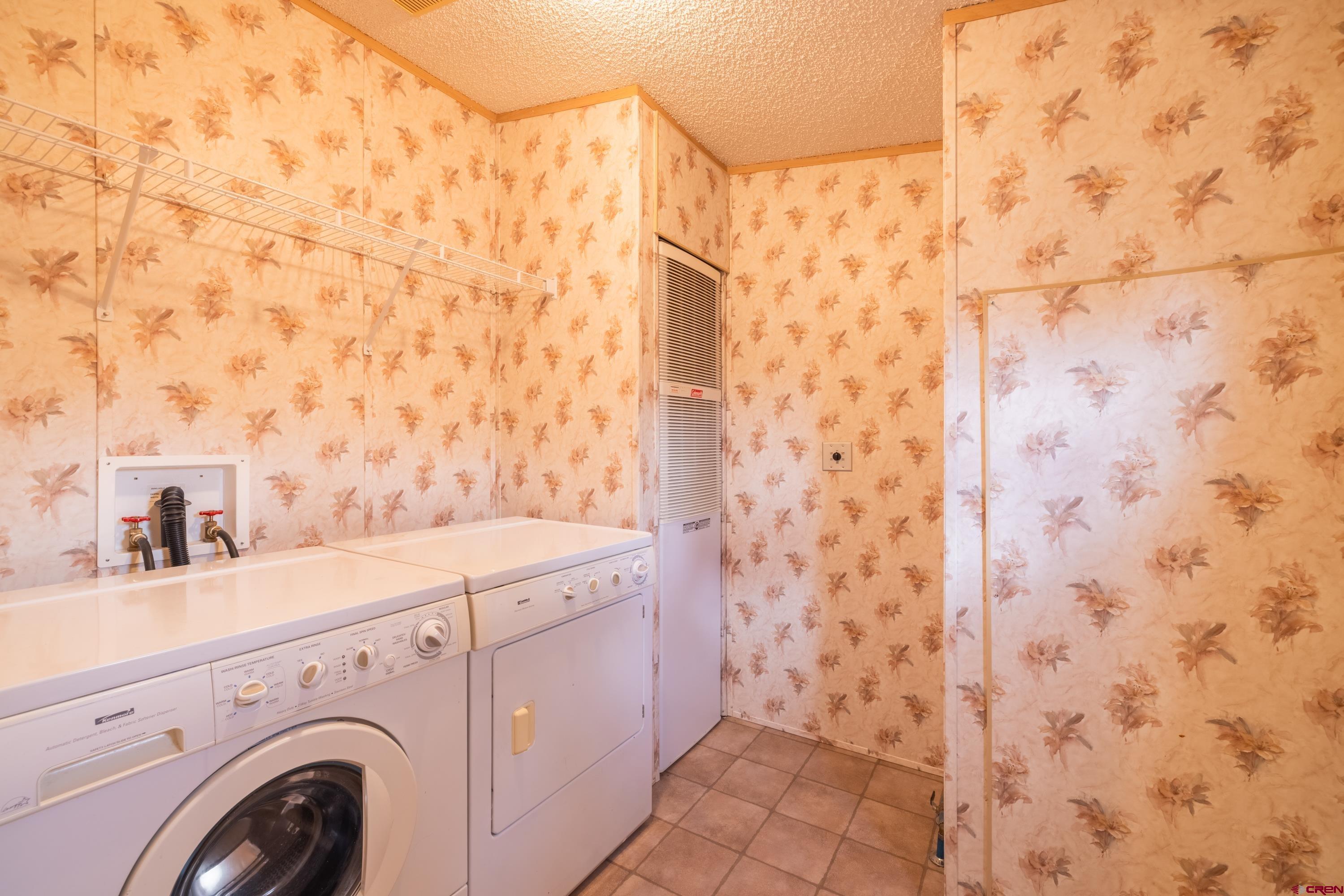 901 6530 Road, Unit 1203 Montrose, CO 81401 - Photo 19 of 22 a utility room with dryer and washer