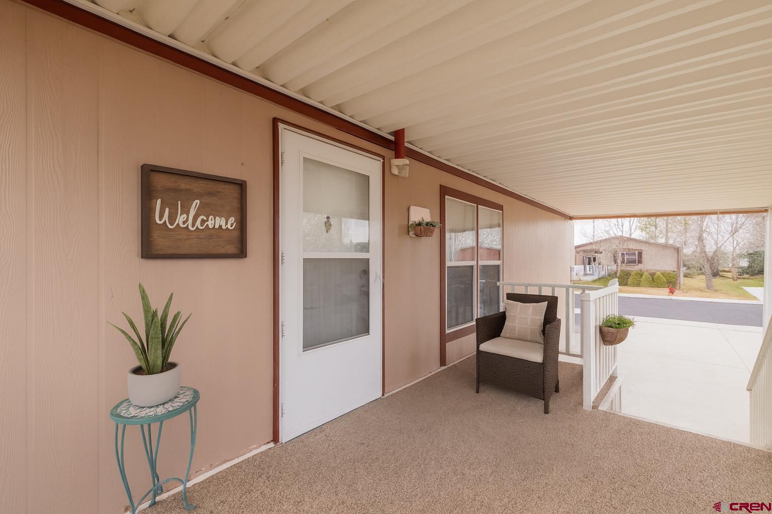 901 6530 Road, Unit 1203 Montrose, CO 81401 - Photo 20 of 22 a view of livingroom with furniture and entryway