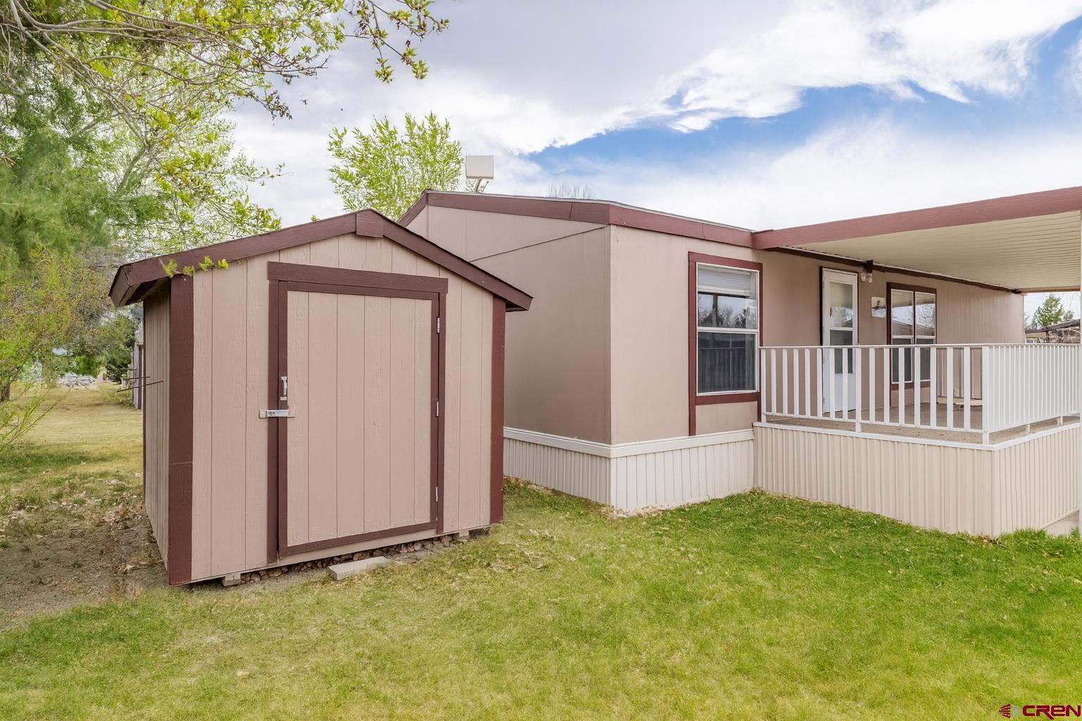 901 6530 Road, Unit 1203 Montrose, CO 81401 - Photo 21 of 22 a view of front door and yard