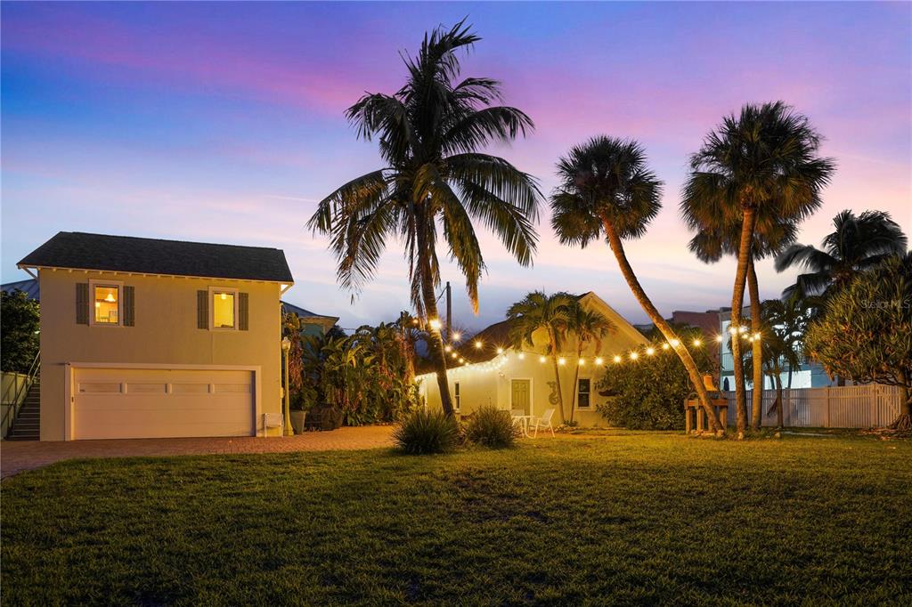 702 Pass A Grille Way St. Pete Beach, FL 33706 - Photo 37 of 41 a house view with a swimming pool