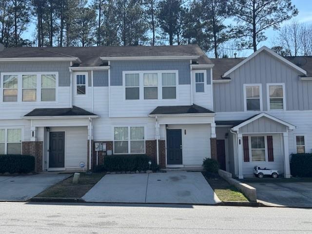 a front view of a house with yard