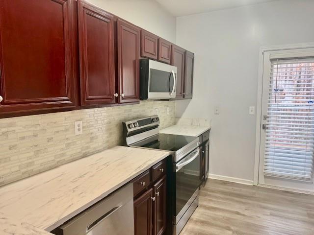 4433 Watson Ridge Drive Stone Mountain, GA 30083 - Photo 13 of 48 a kitchen with stainless steel appliances granite countertop a sink stove and microwave